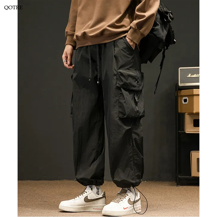 Elasticity Solid Color Tapered Versatile Bellows Pocket Loose Fit Cargo Pants