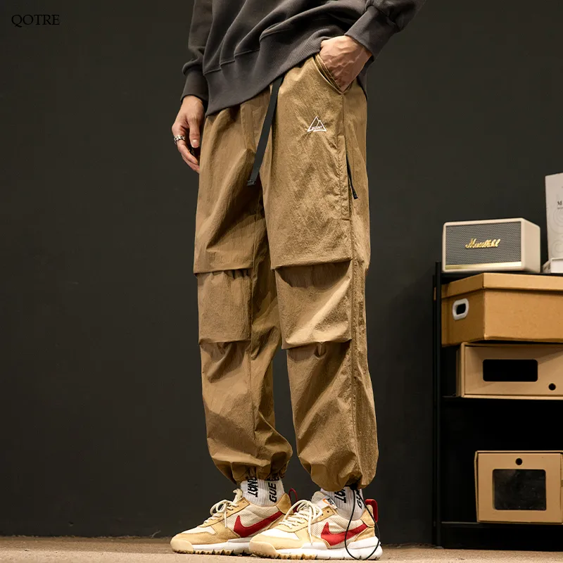 Loose Fit Drawstring Hem Elasticity Tapered Cargo Pants